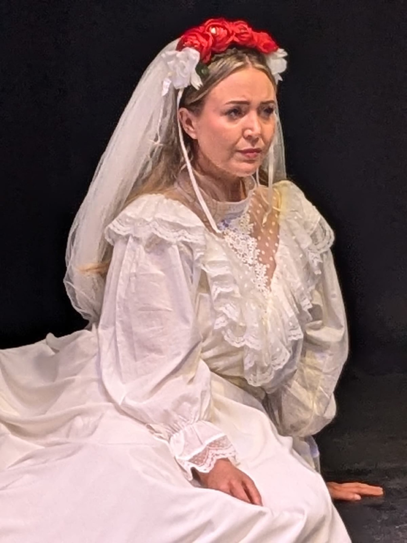 A performer in bridal costume