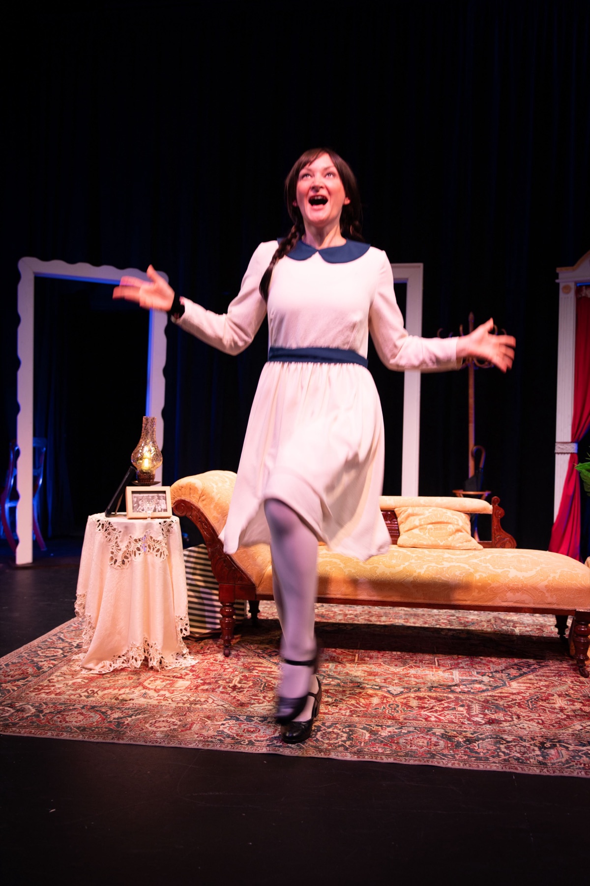 A performer crossing the stage
